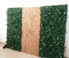 two wooden panels with green plants growing on them