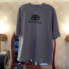 Balenciaga "Double B" Logo T-Shirt - Heather Grey - 100% Cotton - Never Worn - Made In Portugal Designer Short Sleeve T-shirt With Letter Print, Designer Logo Crew Neck Top, Designer Logo Tops With Crew Neck, Designer Letter Print Crew Neck Top, Designer Crew Neck Top With Letter Print, Designer Crew Neck Shirt With Logo Print, Designer Crew Neck Top With Logo Print, Designer Logo Print Short Sleeve Shirt, Designer Short Sleeve Logo Print Shirt