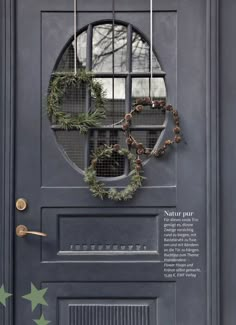 a door with wreaths hanging on it