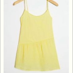 Cotton Flowy Tank By Good Luck Tee Featuring An Asymmetrical Seam Purchased From Anthropologie. Perfect For Summer Days. Size Xs. New With Tags Casual Mini Length Tank Top For Summer, Chic Yellow Asymmetrical Top, Asymmetrical Solid Color Tank Top For Summer, Summer Daywear Cami Top, Yellow Asymmetrical Summer Tops, Solid Color Spring Cami Top, Yellow Cami Top For Summer, Solid Color Cami Top For Spring, Spring Asymmetrical Cotton Tank Top