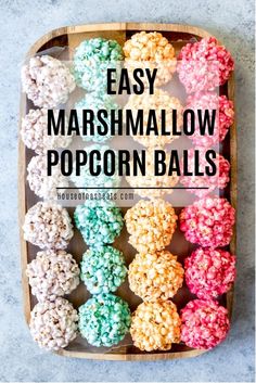 easy marshmallow popcorn balls in a wooden tray