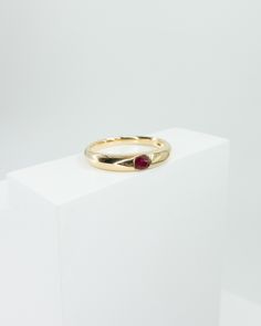 18k solid yellow gold sleek high shine slim dome ring featuring one natural pigeon blood ruby stone ruby weight 0.154ct ring band width 3.3mm to 2.1mm total weight 2.3g size 5.5 in stock Blood Ruby, Dome Ring, Ruby Stone, Solid Gold Rings, Domed Ring, Single Earring, Cuff Earrings, Pendant Bracelet, Ring Band