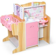 a wooden toy kitchen with pink appliances and accessories