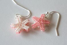 These adorable double sided starfish earring sets are handcrafted with over 300 tiny colorful beads. They have a slight life-like curve to them- almost like they were just plucked from the ocean. Choose from 7 different colors (combined with white), or double sided gold or silver. They are attached to gold or silver plated hypoallergenic earring hooks. Size of beaded starfish = about 1/2 inch (they are small). Don't see a color combo that you like, or have a preference between gold or silver earring hooks? Leave a comment when purchasing and I'll help you create a custom order.  **Please see pictures for sizing compared to a US quarter and for color choices** Beaded Starfish, Starfish Earrings, Earring Sets, Beaded Jewelry Patterns, Hypoallergenic Earrings, Earring Hooks, Color Combo, Double Face, Jewelry Patterns