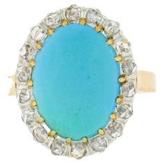 Here we have a very lovely antique turquoise and diamond ring that was crafted in solid 18k gold with a platinum top during the Victorian era. It features a fine, Persian, oval cabochon cut turquoise stone neatly set at its center. The natural stone has a super attractive robin's egg blue color, and is wonderfully complemented by a halo of 18 old rose cut diamonds, adding a glamorous touch with their brilliant sparkles. This ring remains in all original and excellent physical condition with patina intact in which gives this piece its wonderful rosy yellow gold appearance. It is ready to wear upon arrival and will easily stand out with its fine stones and simple design. Enjoy :) --Stone(s):-- (1) Natural Genuine Turquoise - Oval Cabochon Cut - Multi-Prong Set - Robin's Egg Blue Color - 13.8 Turquoise And Diamond Ring, Antique Turquoise, Persian Turquoise, Diamond Halo Ring, Halo Diamond Ring, Genuine Turquoise, Halo Ring, Halo Rings, Diamond Halo