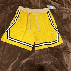 Nwt Woman’s Size Medium Basketball Shorts. Excellent Condition Nike Summer Athleisure Pants, Nike Athleisure Pants For Summer, Nike Sporty Summer Pants, Nike Yellow Workout Shorts, Stretch Yellow Nike Bottoms, Yellow Stretch Nike Bottoms, Nike Stretch Yellow Bottoms, Casual Yellow Nike Bottoms, Nike Yellow Bottoms For Summer