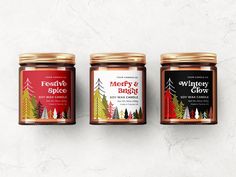 three jars of merry and bright candles on a white background with gold trimmings