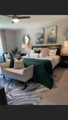 a bedroom with green and white decor in it