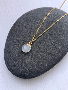 Moonstone Necklace, White Oval Pendant, Silky Moonstone Gold Minimalist Necklace, June Birthstone, Moonstone Layering Jewelry Gift for women This simple dainty necklace features a tiny genuine silky white moonstone oval pendant dipped in your choice of 14k Gold Filled or Sterling Silver. The pearly white pendant is suspended from a delicate chain in the finish of your choice. This is a 100% moonstone gemstone, full of healing properties. This necklace is simply perfect for everyday wear and is p Minimalist Moonstone Pendant Crystal Necklace, Minimalist Moonstone Crystal Pendant Necklace, Minimalist Moonstone Necklace With Delicate Chain, White Minimalist Crystal Necklace, Minimalist Moon Shaped Gemstone Necklace, Oval Moonstone Necklaces With Moon Charm, Minimalist Moonstone Round Necklace, Minimalist Moonstone Necklace With Moon Charm, Minimalist Moonstone Necklace With Moon Phase