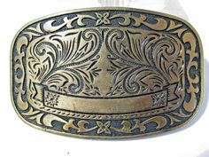 DARKENED BRASS PLATED VINTAGE COUNTRY WESTERN STYLE BELT BUCKLE. THERE IS AN AREA THAT CAN BE MONOGRAMMED BY YOUR JEWELER IF YOU WOULD LIKE TO HAVE THAT DONE. MEASURES APPROX. 1 7/8" X 3" WIDE. GOOD CONDITION, DARKENED BRASS PLATED METAL. Mid Century Fashion, Accessories Vintage, Country Western, Vintage Country, Western Style, Belt Buckle, Vintage Accessories, Vintage Brass, Western Fashion