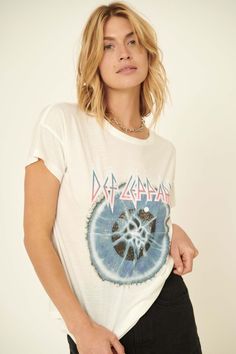 Garment-washed graphic t-shirt. Vintage-style Def Leppard logo print with with Adrenalize album art. Round neckline. Short drop-shoulder sleeves. Loose fit. 100% Cotton. Imported top designed and printed in Los Angeles, CA. Officially licensed Def Leppard merchandise. Not eligible for discounts. White Distressed Tops For Concert, White Soft-washed Band Merch Tops, White Soft-washed Top With Band Merch Style, Graphic Tee For Concerts, Graphic Tee For Concerts, Soft-washed, Soft-washed Graphic Tee For Concert, Soft-washed Graphic Tee For Concerts, Def Leppard Logo, Def Leppard