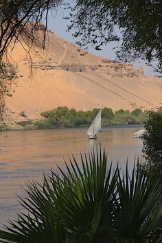 a sailboat is sailing on the river