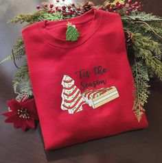 Introducing the Little Debbie Christmas Tree Cake Embroidered Crewneck Sweatshirt – the perfect festive attire for men and women. Made Little Debbie Christmas Tree, Valentine Cartoon, Vintage Christmas Shirt, Festive Attire, Little Debbie, Hawaiian Shirt Women, Crewneck Vintage, Tree Cake, Christmas Tree Cake