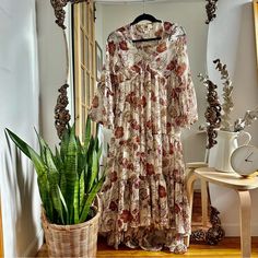 Size: Xs Condition: Excellent - Never Worn Floral V-Neck Tiered High/Low Sheer Maxi Dress. Lined. Material: Polyester Measurements: 54” Shoulder To Hem 18” Pit To Pit Cream Floral Print V-neck Midi Dress, Beige Boho Print Chic Dress, Beige V-neck Boho Dress For Brunch, Chic Beige Boho Print Dress, Flowy Boho V-neck Dress For Casual Wear, Beige Floral Print V-neck Midi Dress, Beige V-neck Floral Dress For Brunch, Flowy Beige Maxi Dress With Boho Print, Flowy Cream Maxi Dress With V-neck