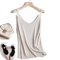 Chic Sleeveless Tank Top, Beige Sleeveless Tank Top With Built-in Bra, V-neck Sweater Vest For Summer, Elegant Sleeveless Sweater Vest For Summer, Stretch Sleeveless Sweater Vest For Summer, Sleeveless Sweater Vest For Summer, Trendy Tank Sweater Vest For Summer, Summer Non-stretch Camisole Tank Top, Beige Stretch V-neck Tank Top