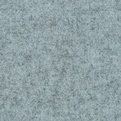 a close up view of the surface of a gray carpet