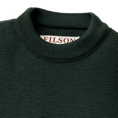 Made in the USA, the Filson Crewneck Guide sets the standard for what a sweater should be–non-bulky, with a smooth finish and density that makes it exceptionally warm and durable. With ample stretch and outstanding breathability, our Crewneck Guide Sweater would be unnoticeable to wear, if not for its exceptional warmth. The rib-knit collar, cuffs and hem ensure a custom fit and retain their shape year after year. The U.S. -sourced wool is sourced from U.S. from merino sheep prized for their lon Green Wool Sweater With Ribbed Collar, Outdoor Long Sleeve Merino Wool Sweater, Outdoor Merino Wool Long Sleeve Sweater, Classic Winter Outdoor Sweater, Outdoor Knit Sweater With Ribbed Cuffs, Natural Rain, Merino Sheep, Sweaters Crewneck, Knit Collar