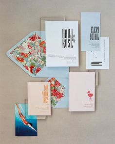 the stationery is laid out neatly on top of each other, including cards and envelopes