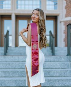 a woman wearing a red and gold sash