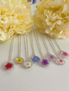 Beautiful and dainty real small flower set inside resin, each one is handmade making a unique necklace. All jewellery pieces come inside a drawstring pouch with a jewellery care card, wrapped inside tissue paper, presented in a little handmade box. Want to shop the full collection? Matching Bracelet - https://www.etsy.com/uk/listing/1380144493/dainty-preserved-blossom-flower-bracelet?click_key=d512c544f1ab11905a428188eb43777ee42cae33%3A1380144493&click_sum=6f5c97b9&ref=shop_home_active_7&clickFr Real Flower Necklace, Preserved Flowers, Handmade Box, Botanical Jewelry, Matching Bracelet, Unique Necklace, Care Card, Silver Plated Necklace, Drawstring Pouch