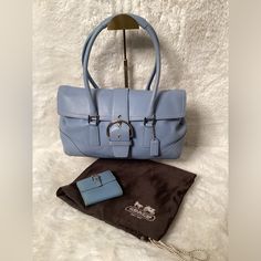 Authentic Baby Blue Coach Leather Shoulder Bag. Bag Has A Matching Wallet; Sold Separately. Bag Was Lightly Used And Is Still In Great Condition. Comes With A Dust Bag. Please See Photos For The Condition Of The Bag. Reasonable Offers Are Welcomed. Classic Light Blue Shoulder Bag For Everyday Use, Luxury Blue Pouch Satchel, Elegant Light Blue Travel Bag, Elegant Light Blue Office Bag, Light Blue Leather Rectangular Satchel, Light Blue Leather Satchel, Elegant Blue Soft Leather Shoulder Bag, Elegant Light Blue Shoulder Bag For Travel, Elegant Light Blue Double Handle Satchel