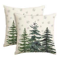 two pillows with pine trees on them