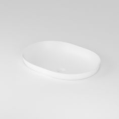 an apple logo is shown on the side of a white plate that has been placed in front of it