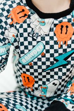 Get your little ones ready for spooky season with our "Ghosts on Skateboards Halloween Pajamas"! These Personalized Halloween Ghost Pajamas are perfect for kids aged 6 months to 10 years, making them a great gift for moms and grandmas. Each set is made to order, ensuring a unique and special touch. The Halloween pajamas feature adorable ghosts on skateboards against a black and white checkered background, adding a playful twist to Halloween nightwear. Crafted from durable, super soft, and stretc Playful Halloween Sleepwear, Halloween Pjs, Blanket Cape, Checkered Background, Halloween Pajamas, Adult Pajamas, Pajama Dress, Minky Baby Blanket, Minky Baby