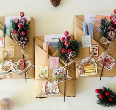 three envelopes decorated with christmas cards and decorations