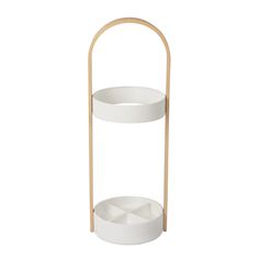 a white shelf with two round shelves on it