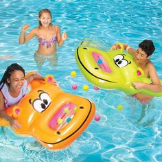 children playing in the swimming pool with their floaties and rafts, including a tiger