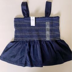 Nwt Gap Kids Smocked Tank Size M (8) Navy Casual Blue Cotton Smocked Top, Cotton Tops With Smocked Bodice, Casual Cotton Smocked Top With Smocked Cuffs, Blue Cotton Smocked Top, Casual Blue Top With Smocked Back, Fitted Blue Tops With Elastic Waistband, Fitted Blue Cotton Smocked Top, Kids Smock, Boys Tank Tops