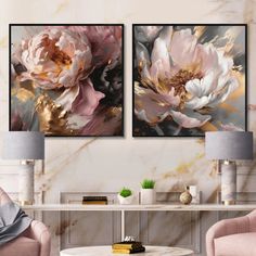 two paintings on the wall in a living room with pink chairs and a coffee table