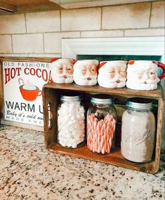 a shelf filled with candy canes and santa's faces on top of it