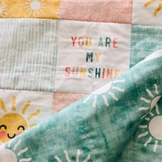 a quilt with the words you are my sunshine printed on it