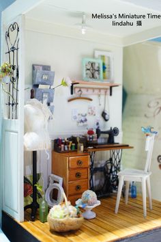 a doll house with furniture and accessories on the table in front of a mirror that reads mellisa's miniature time