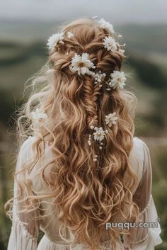 a woman with long hair and flowers in her hair