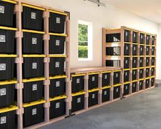 a room filled with lots of black and yellow bins