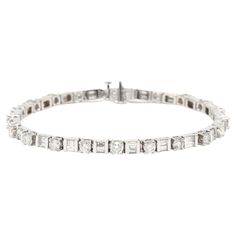 This stunning 5.50ctw diamond tennis bracelet is the perfect way to make a statement. Crafted from 14K white gold in a length of 7 inches, this bracelet features a dazzling line of round and baguette diamonds that sparkle and shine. This beautiful bracelet is the perfect accessory for any special occasion and will be a treasured favorite for years to come. Stones: - diamonds - round brilliant cut, 21 stones - 3.2 - 3.4 mm - approximately 3.15 total carats - baguette, 42 stones - 2.5 x 1.75 mm - Recycled Bracelets, Bracelet Tennis, Diamond Tennis Bracelet, Baguette Diamonds, Diamond Chain, Fine Jewelry Bracelets, Tennis Bracelet Diamond, Cute Bracelets, Baguette Diamond