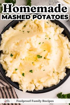 mashed potatoes in a black bowl with parsley on top and the title overlay reads homemade mashed potatoes