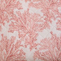 a close up view of the coral print on this bedding set, which is very soft