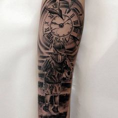 a man's arm with a clock tattoo on it and an image of a person