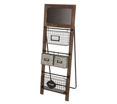 a wooden shelf with three baskets and a chalkboard on the top, in front of a white background