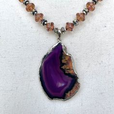 Unique purple dyed agate pendant.  Accented with beautiful glass beads.  A true statement necklace Unique Purple Gemstone Bead Necklaces, Unique Purple Gemstone Beaded Necklaces, Elegant Purple Agate Beaded Necklaces, Elegant Purple Agate Beaded Necklace, Beaded Agate Pendant Necklace, Purple Spiritual Necklace With Large Pendant, Spiritual Purple Necklace With Large Pendant, Agate Pendant Beaded Necklaces, Spiritual Czech Glass Pendant Necklace