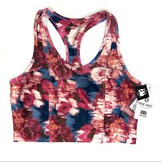 Nine West Active Racerback Sports Bra Blue Background, Floral Print Moisture Wicking Breathable Comfort 4-Way Stretch Removable Cup Inserts Pink Spring Activewear With Built-in Bra, Casual Racerback Activewear With Built-in Padding, Multicolor Breathable Athleisure Activewear, Multicolor Breathable Activewear For Yoga, Casual Workout Tank Top With Built-in Padding, Summer Activewear With Racerback And Built-in Padding, Multicolor Functional Activewear For Workout, Multicolor Functional Workout Activewear, Functional Multicolor Activewear For Workout