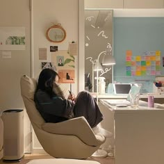 a woman sitting on a chair in an office