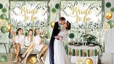 the bride and groom are kissing in front of their wedding party photoboot backdrops