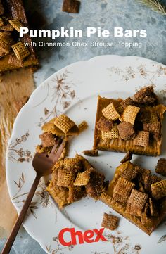 pumpkin pie bars with cinnamon chex crust topping on a plate next to a fork