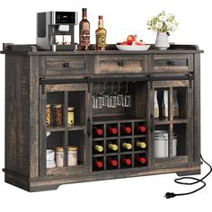 a kitchen island with wine glasses and bottles on it's side, next to an appliance