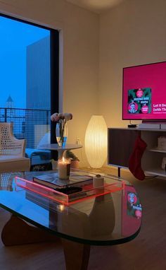 a living room filled with furniture and a flat screen tv on top of a wall